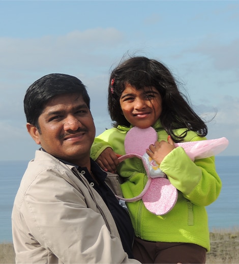 Venkat holding his daughter Venkat holding his daughter