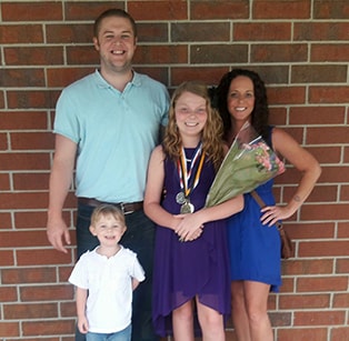 Ryan posing with his family