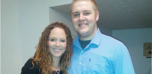 Ryan posing with his wife