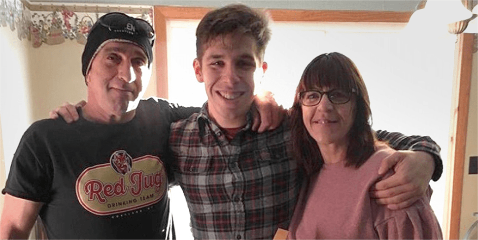 Brandon posing with his parents