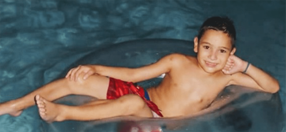 Juan Pablo swimming in the pool as a child.