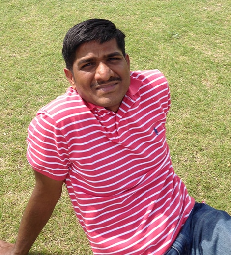 Venkat sitting in the park on grass
