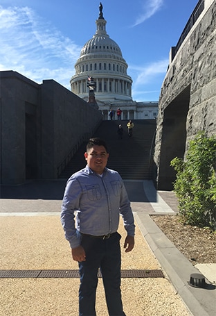Zach posing outside the United States Capitol building.