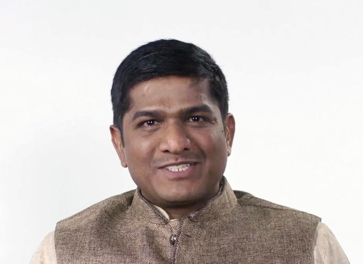 Image of Venkat smiling with his introduction and the My Journey to JIVI® logo on the side