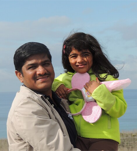 Venkat holding his daughter