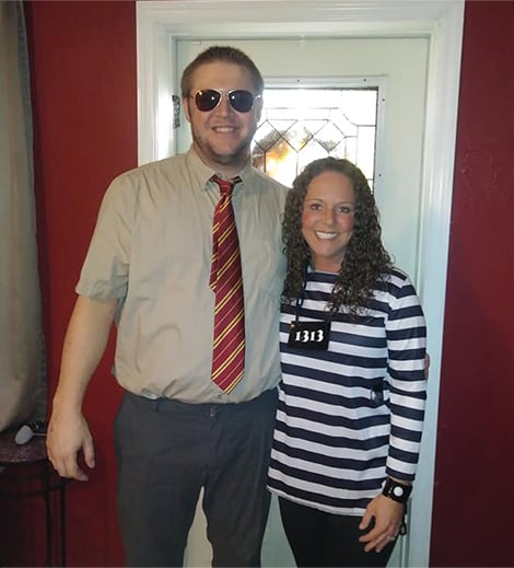 Ryan posing with his wife in Halloween costumes